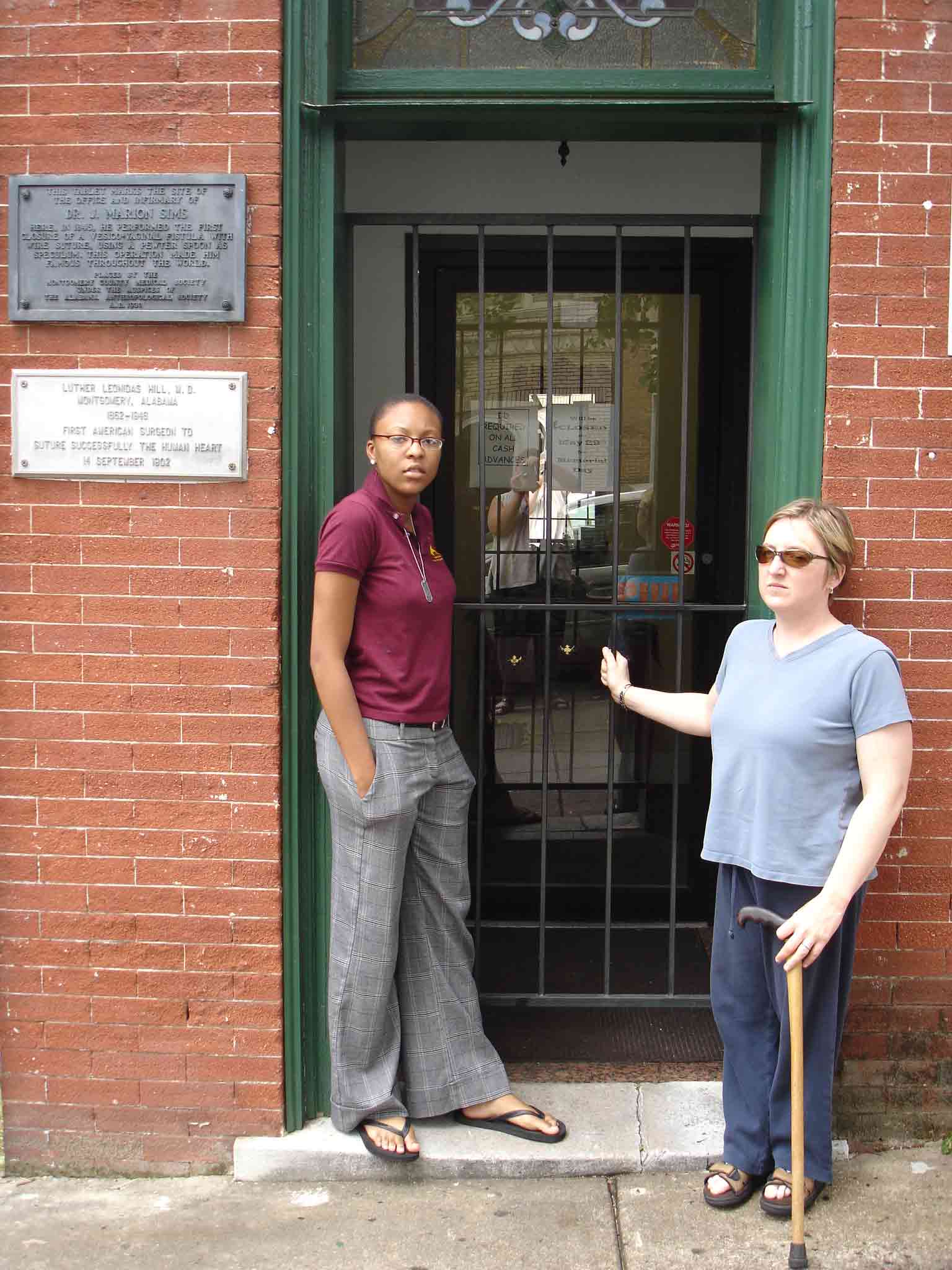 Carrie and Tabitha in front of the home where the plaque celebrating Sims is attached